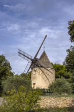 Antique windmill in rural landscape, Gordes, Vaucluse, France.