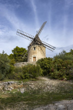 Antique windmill in rural landscape, Gordes, Vaucluse, France.