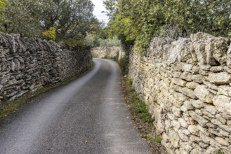 Empty path between old stone walls, Gordes, Vaucluse, France.