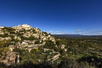Old town on hill on sunny day, Gordes, Vaucluse, France.