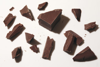 Broken block of chocolate on white background, New York City, New York, USA.