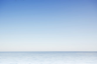 Clear morning sky above calm surface of North Atlantic, Nantucket, Massachusetts, USA.
