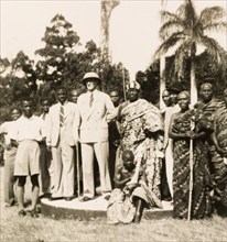 Empire Day in Aburi, 1950. A European colonial officer stands outdoors with an Agona chief, posing