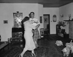 Highland jig. Peter Buchanan and Noreen dancing in a colonial house on the christening of Peter's