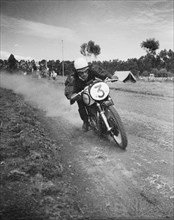 Race seven. Motorcycle rider Vic Preston puts his foot down during race seven at the Eldoret race