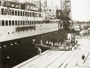 Disembarkation from SS Franconia. Crew and passengers disembark from SS Franconia at Kilindini