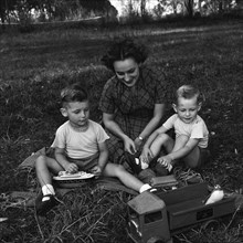 Cecily and children. Cecily Gaueghan playing with her two sons. The boys are playing with some toys