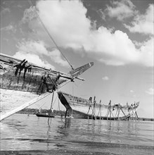 Dhows in a harbour. Dhows in a harbour off the coast of Zanzibar (now Tanzania) in the Indian ocean