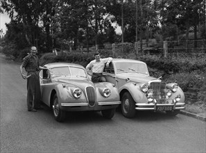 Men with motors. Proud car owners Peter Knight (left) and Archer (right), pose with their