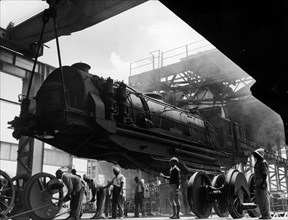 Assembling a locomotive. A publicity photograph from the East African Railways and Harbours