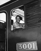 Julius Nyerere in the driver's seat. A publicity photograph from the East African Railways and