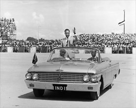 Julius Nyerere greets crowds. A publicity photograph from the East African Railways and Harbours