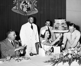 Princess Margaret receives a lamp. A publicity photograph from the East African Railways and