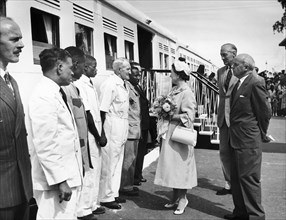 The Queen Mother greets a train driver. A publicity photograph from the East African Railways and