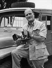 Portrait of a photographer. A publicity photograph from the East African Railways and Harbours