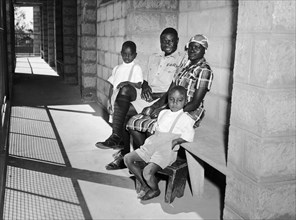 Railway family in Kenya. A publicity photograph from the East African Railways and Harbours