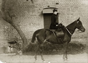 Victorian lady on horseback. Portrait of a Victorian lady on horseback. Dressed in black, she rides