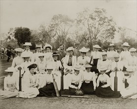 Victorian ladies' cricket. Two ladies' cricket teams in their sporting whites pose for the camera