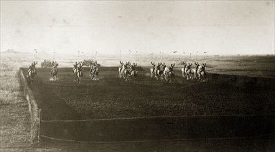 Cavalry practice ground. British men from an Indian Army cavalry unit cross each other in an arena