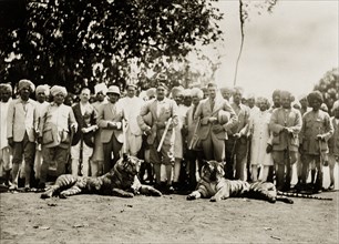 Indian hunting party. A hunting party of Indian men, some in Western dress, pose proudly beside the