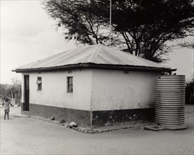 A permanent Maasai home. Portrait of a permanent Maasai home, a square building with a pitched roof