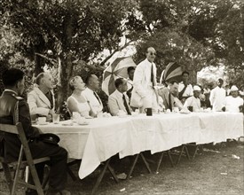Speech at Rangoon Golf Club. R.B. Groves, a Captain of the Rangoon Golf Club, stands to deliver a