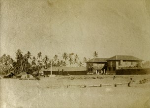 Custom House, India. A Kerala Custom House surrounded by palm trees on the beach. Calicut, India,