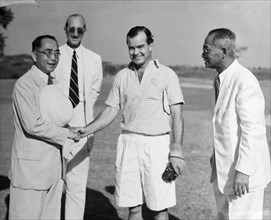 Winner of the Burma Open Championship. The President of the Rangoon Golf Club gives a
