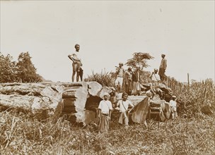 Logging expedition, Burma (Myanmar). Several Burmese lumberjacks pose for the camera beside a