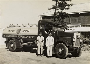 Indo-Burma Petroleum Company tanker. Two uniformed Burmese workers pose for a photograph in front