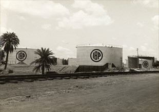 Indo-Burma Petroleum Company plant. Exterior shot of several large petrol storage tanks at the