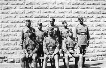 Warders at Nairobi Jail. Group portrait of eight African jail warders wearing uniform. Nairobi,