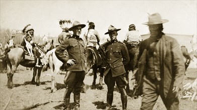 Royal Canadian Mounted Police. Two uniformed Royal Canadian Mounted Policemen at a native American