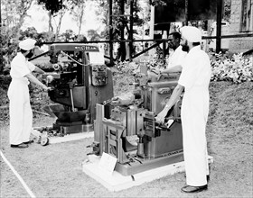 Milling machines at the Royal Show. Two turbaned Indian men demonstrate milling machines at the G &