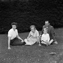 Neville Vincent and family. Family portrait of Neville Vincent, his wife and their two children.