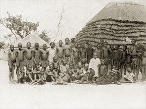 Balanda children. A large group of semi-naked Balanda children gather for the camera outside a