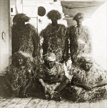 King Neptune's bears. Five crew members aboard ship are covered in straw, disguised as King