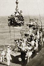 Children's party on the high seas. A group of children packed tightly onto a small platform are