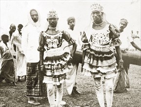 Ceylonian dancers. Two Ceylonian men dressed in traditional dance costumes wear ornate headdresses