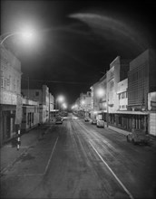 Gulzaar Street by night. Streetlights illuminate a deserted Nairobi street identified as 'Gulzaar