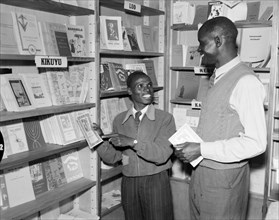 Kenyan book shop. Promotional shot for the East African Literature Bureau. Two African men exchange