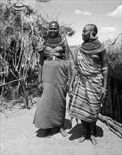 Two Samburu women. Portrait of two young Samburu women in a village. Both wear traditional dress,