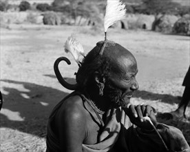 An elderly Turkana man. Portrait of an elderly Turkana warrior, his hair braided and decorated with