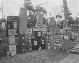 P.G. Warren & Co at the Royal Show. A variety of goods in boxes and barrels are stacked up on