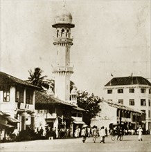 Kapitan Keling mosque. Penang street scene featuring the prominent yellow-domed minaret of the