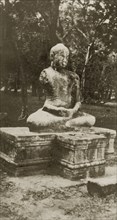 Buddah statue. A statue of a Buddha belonging, according to the original caption, to a lost city.