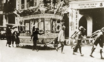 Chinese funeral carriage. An elaborately decorated funeral carriage adorned with wreaths, banners