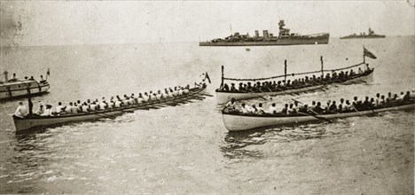Samoan canoes. Large groups of rowers aboard long canoes off the coast of Western Samoa. Pacific