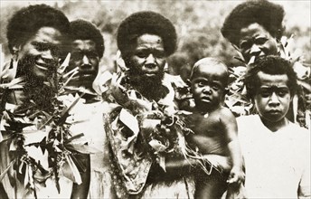 Fijian people. Portrait of a group of Fijian people with a baby. The three women pictured wear