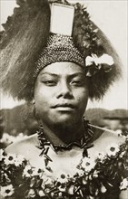 Wife of a Samoan chief. The wife of a Samoan chief wears traditional 'meke' costume. Her long hair